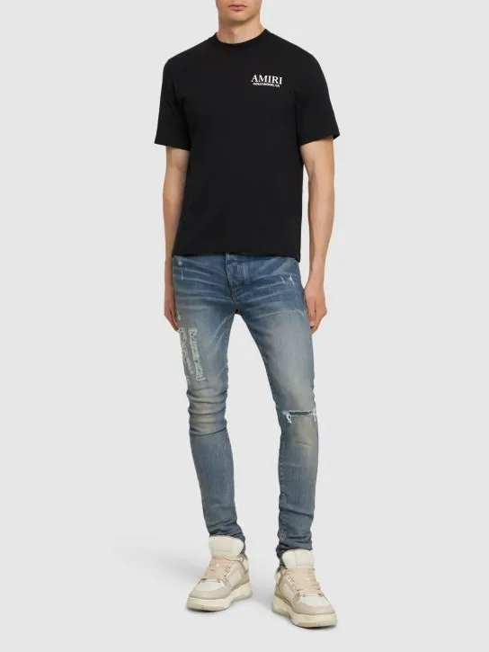 Amiri   Amiri logo distressed jeans 