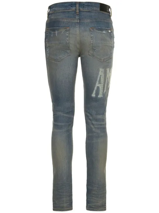Amiri   Amiri logo distressed jeans 