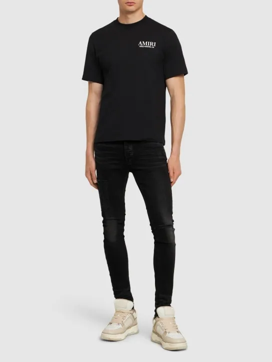Amiri   Amiri logo distressed jeans 