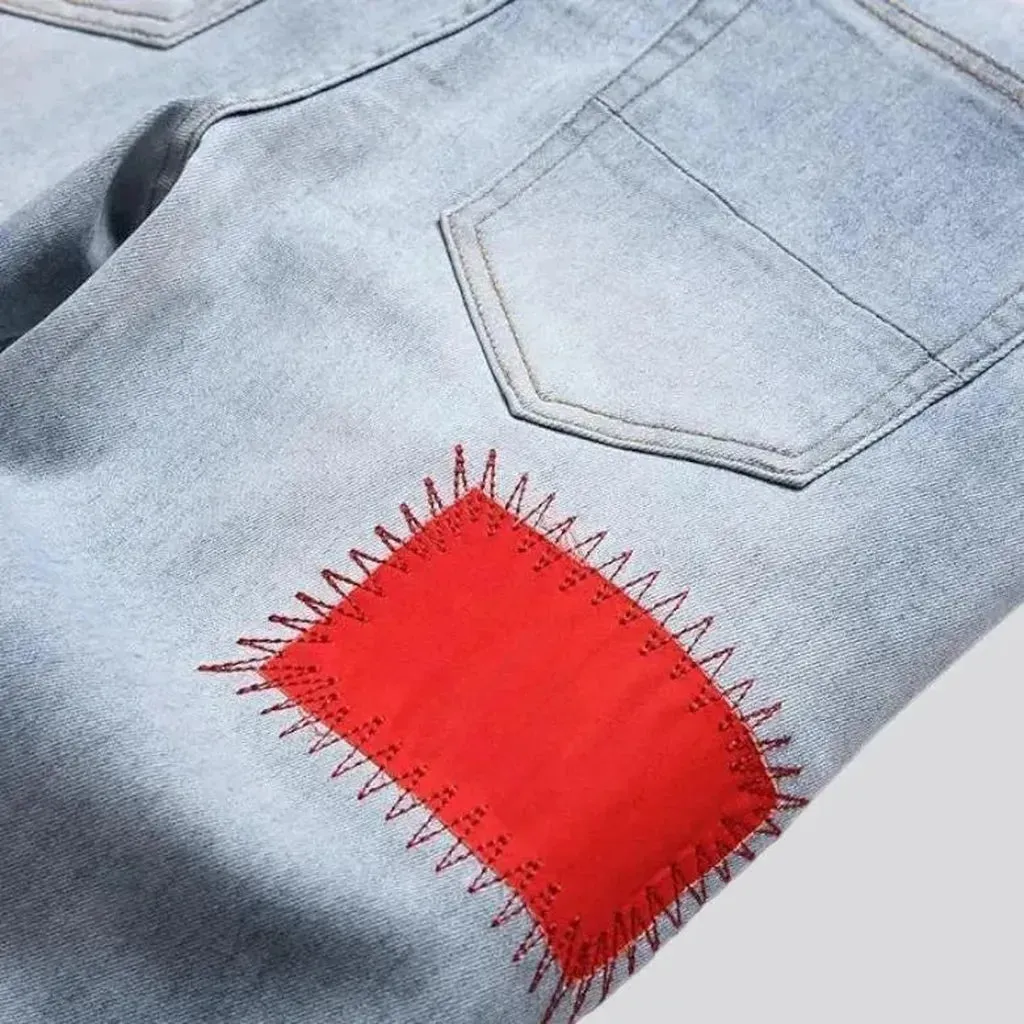Light-wash color-patches jeans
