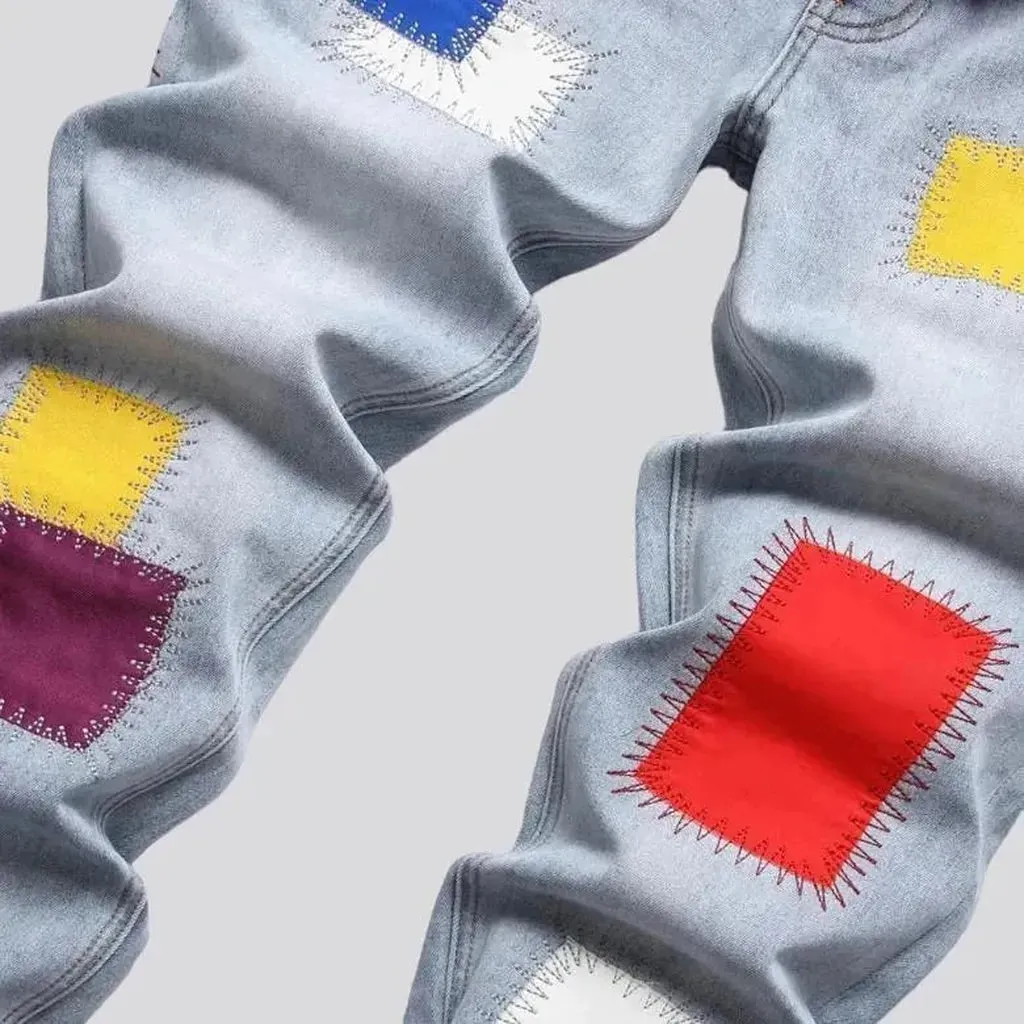 Light-wash color-patches jeans