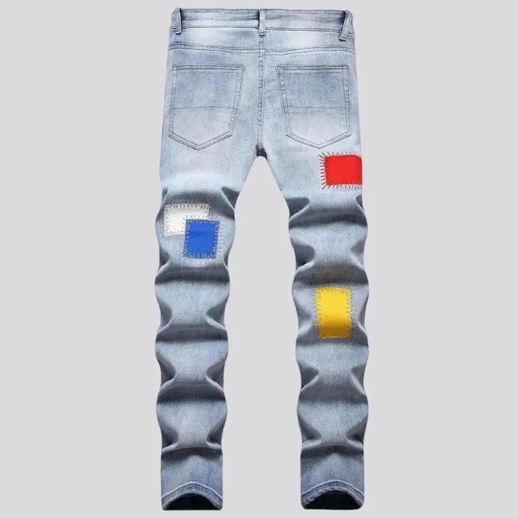 Light-wash color-patches jeans