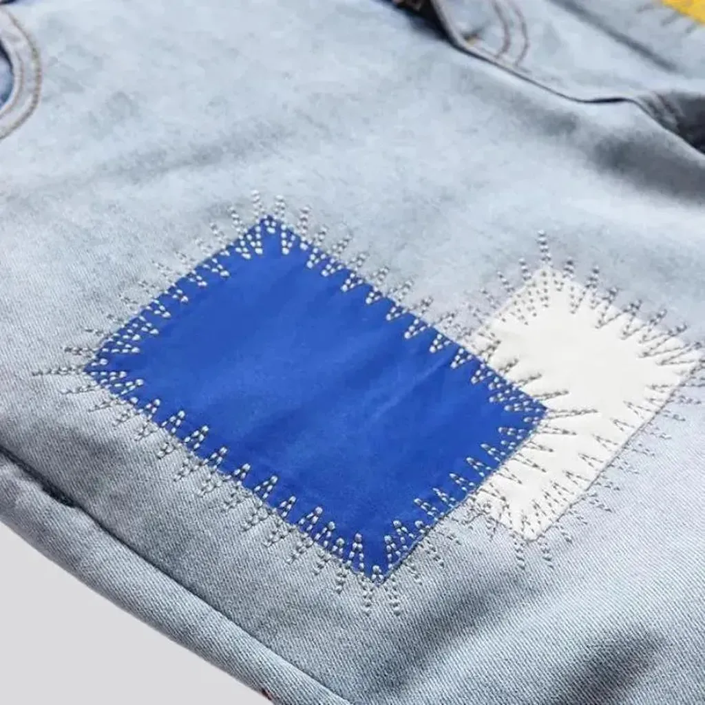 Light-wash color-patches jeans