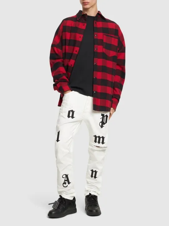 Palm Angels   Bull logo patch jeans 