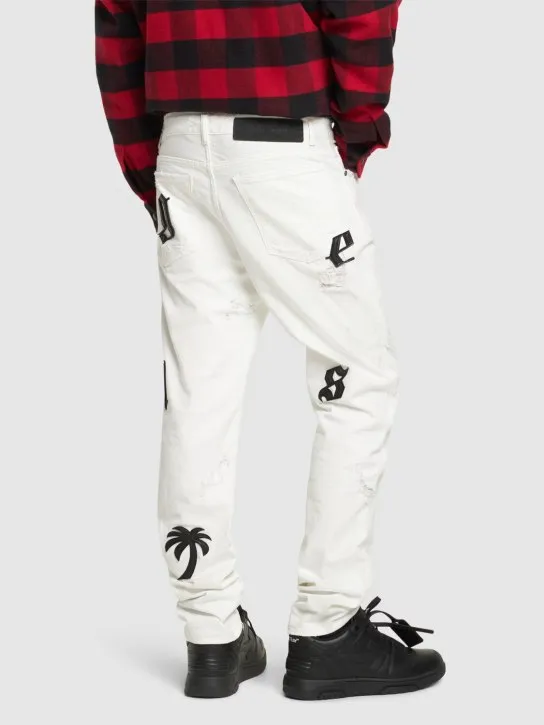 Palm Angels   Bull logo patch jeans 